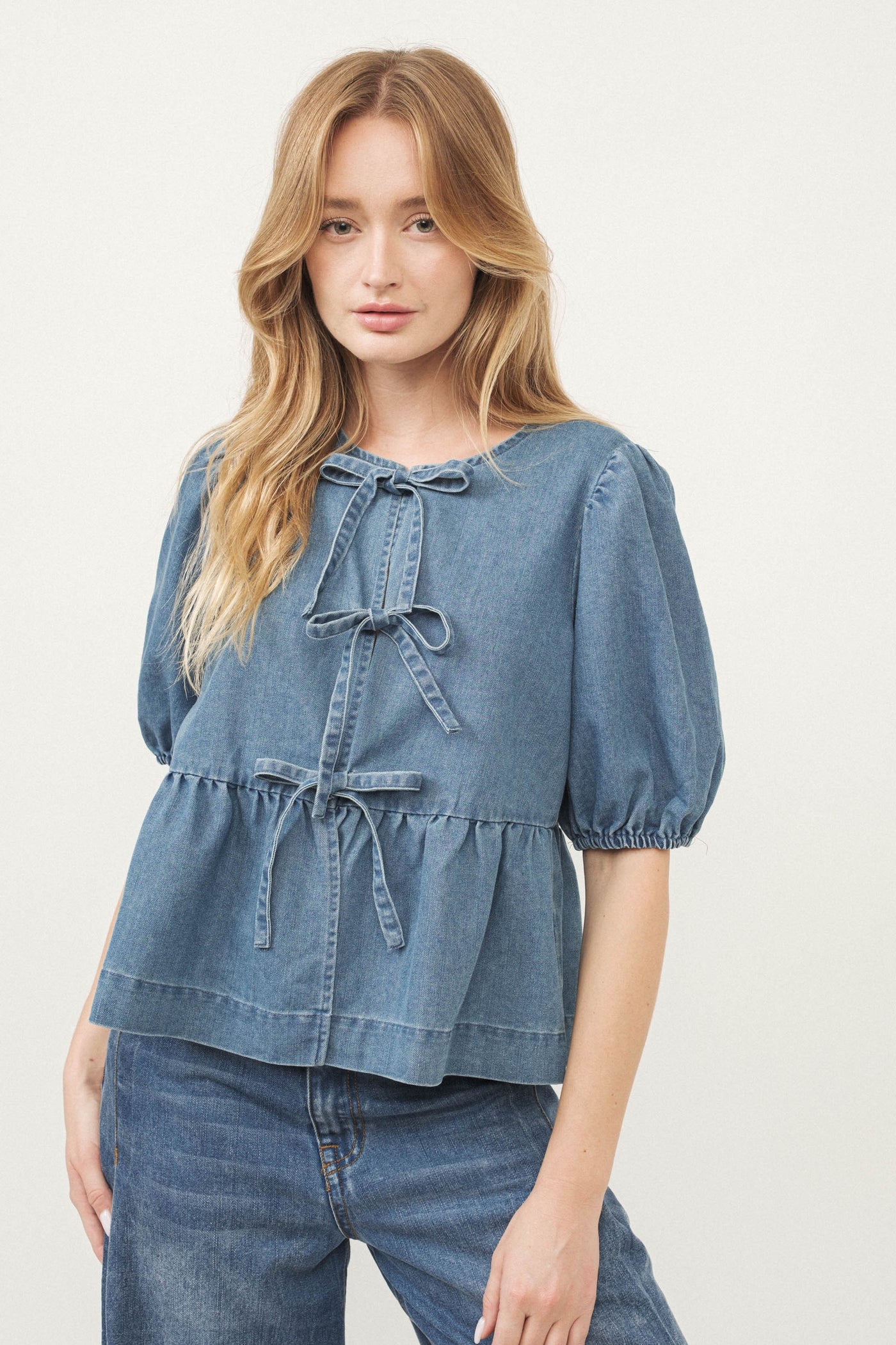 DENIM BOW PEPLUM